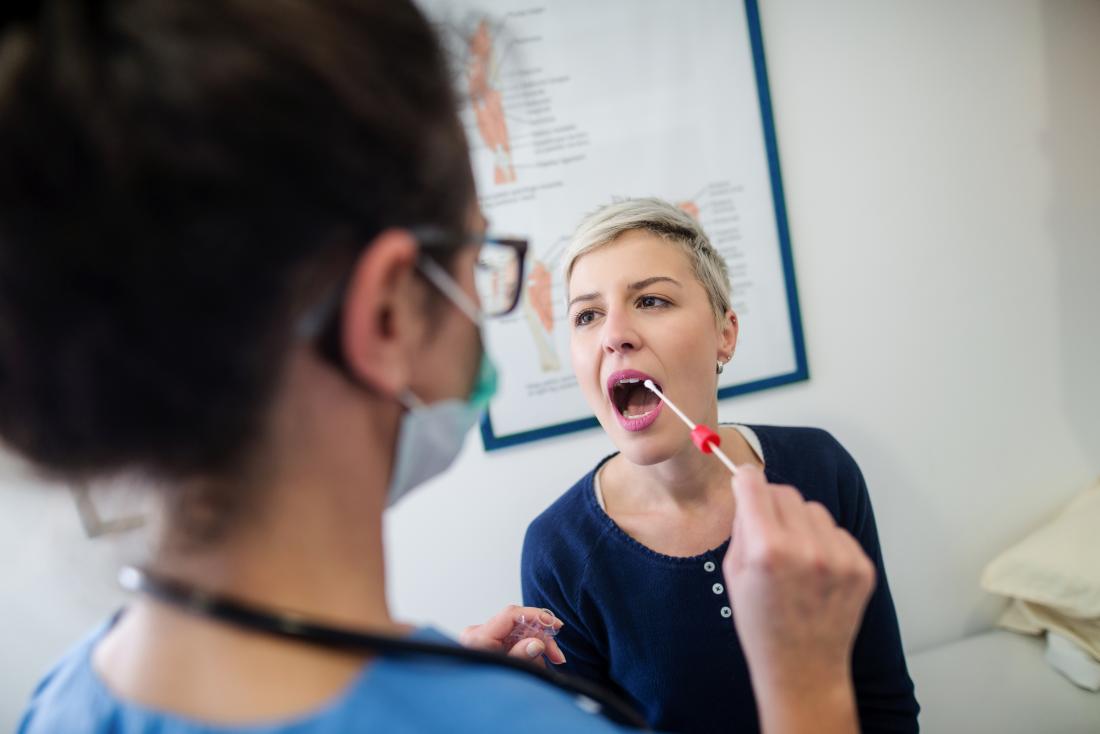 Nurse takingsaliva sampl with swab for testing hydrocodone levels in body