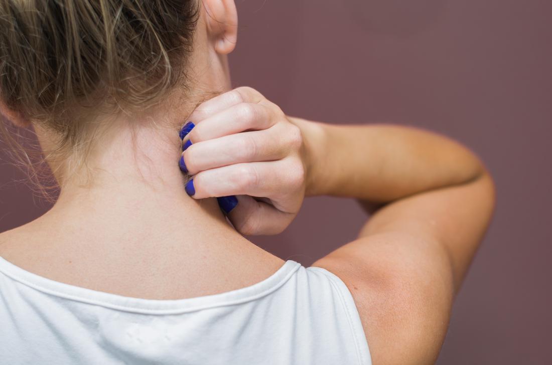 a woman with an itchy neck