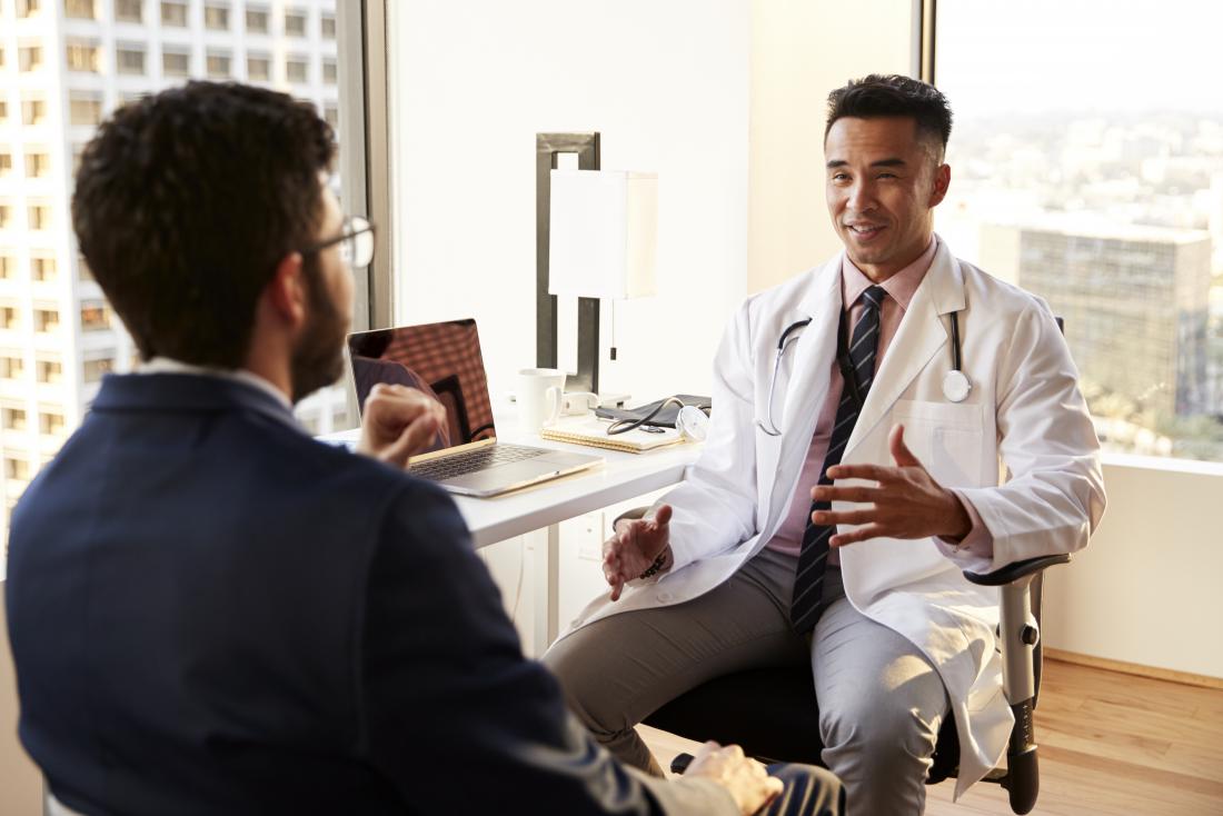 doctor smiling and explaining inflammation to patient