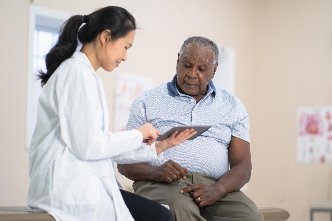 doctor talking to senior patient