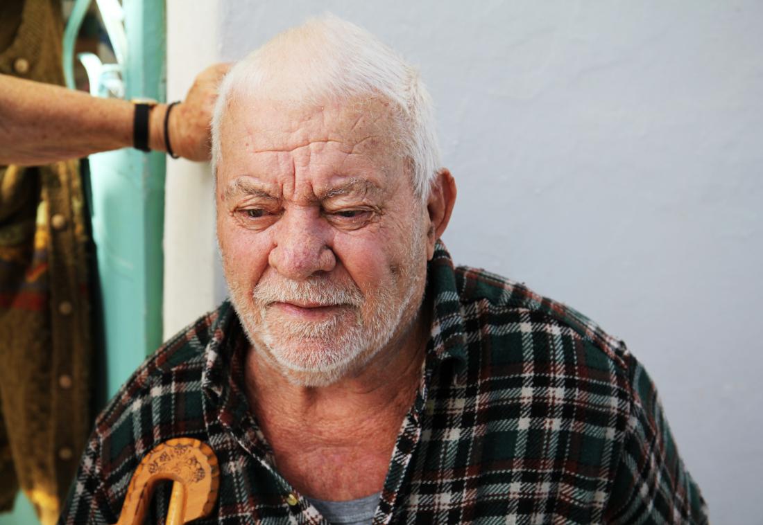 image of older man looking down