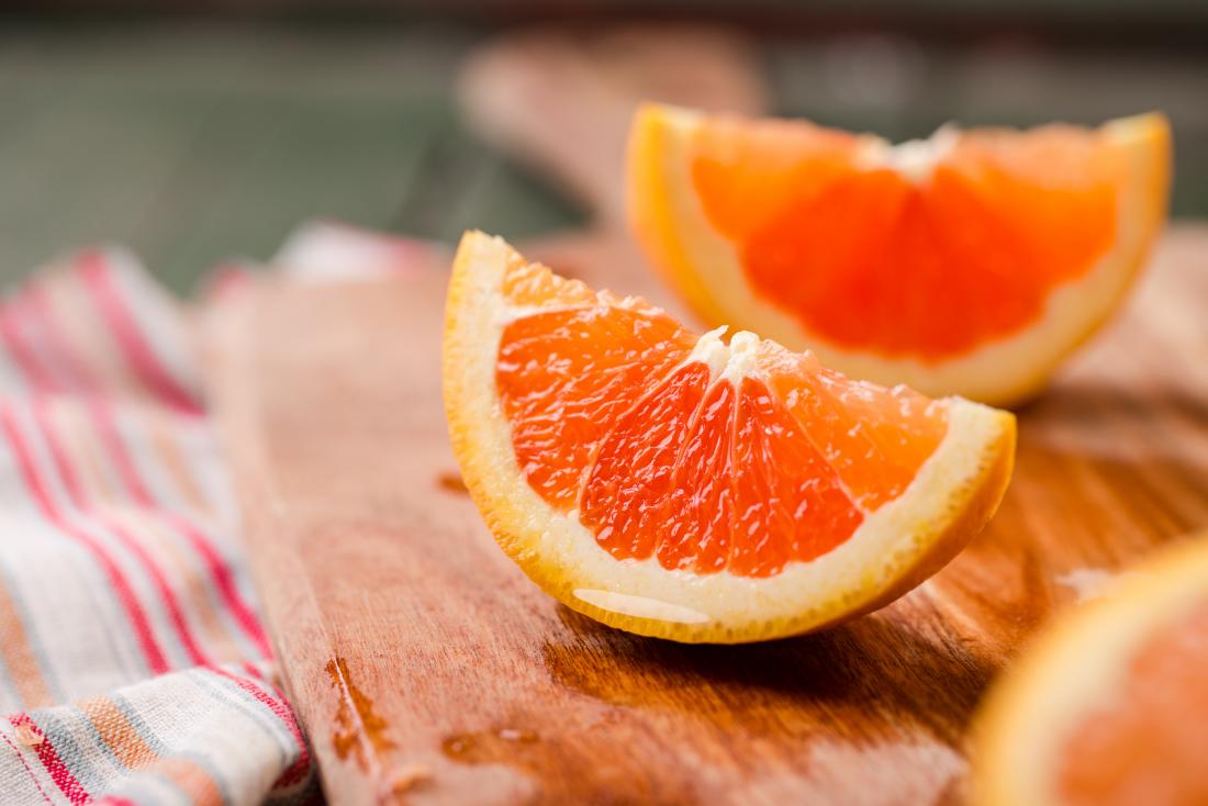 Oranges isolated on wood background