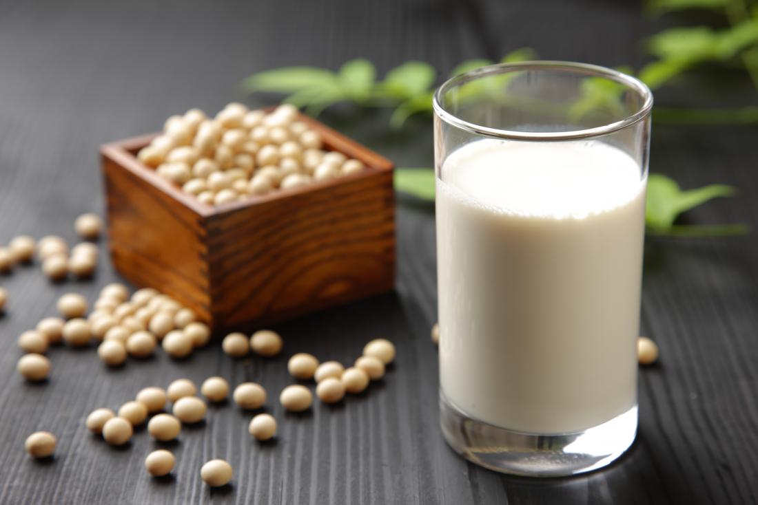 soymilk and dried soy beans on a table.