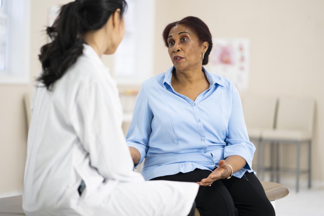 a doctor speaking to a patient