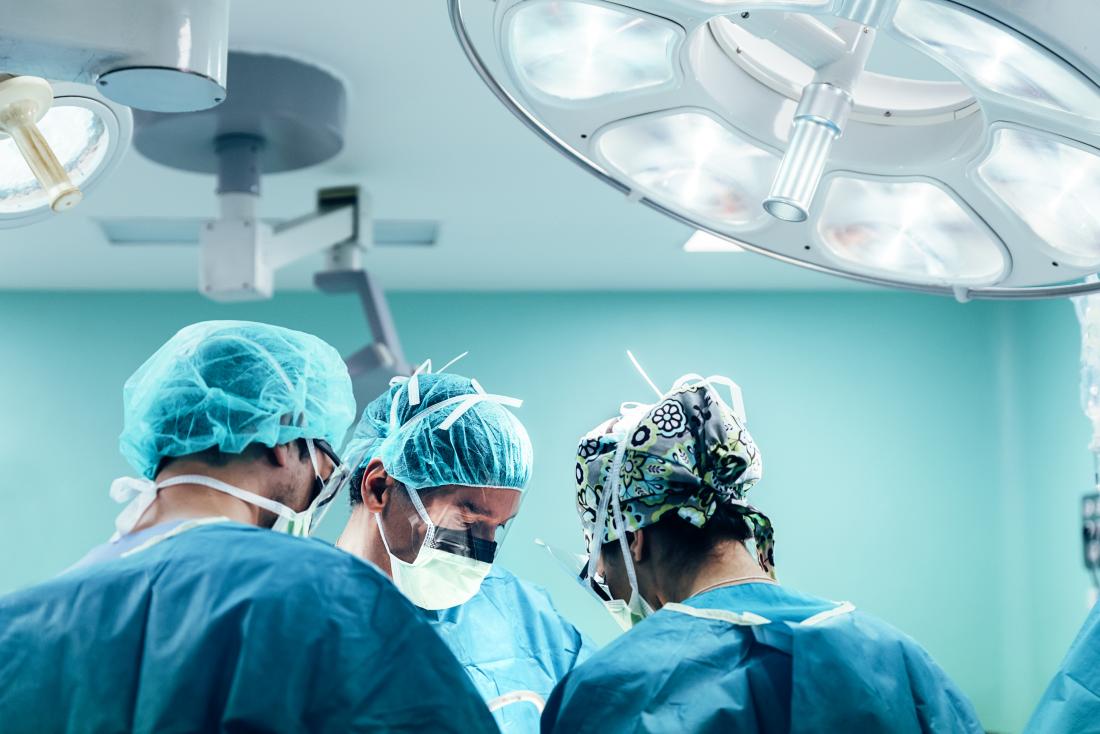 surgeons performing gastrectomy in operating theatre