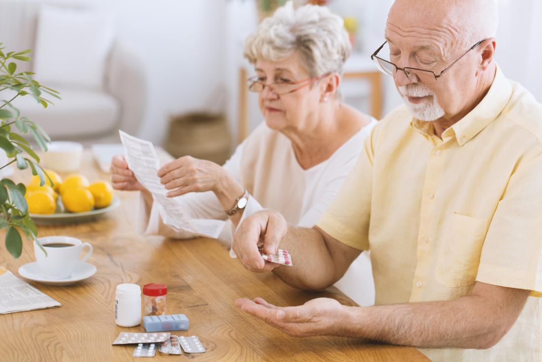 senior man taking medication