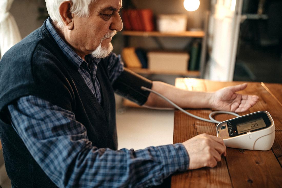 Man checking blood pressure