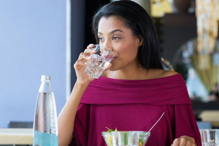 young woman drinking water