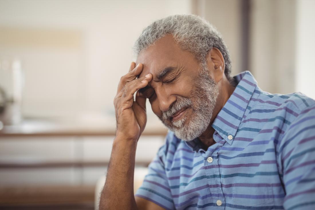 man with headache as part of stroke symptoms