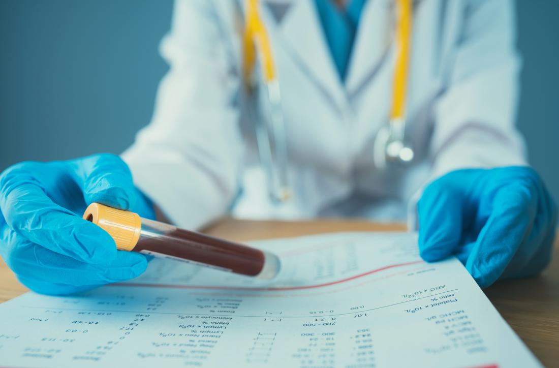 Researcher holding blood sample