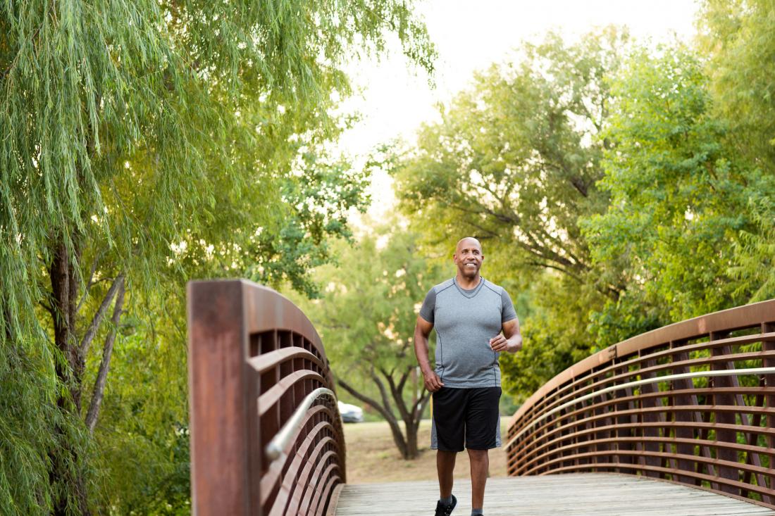 man walking on bridge