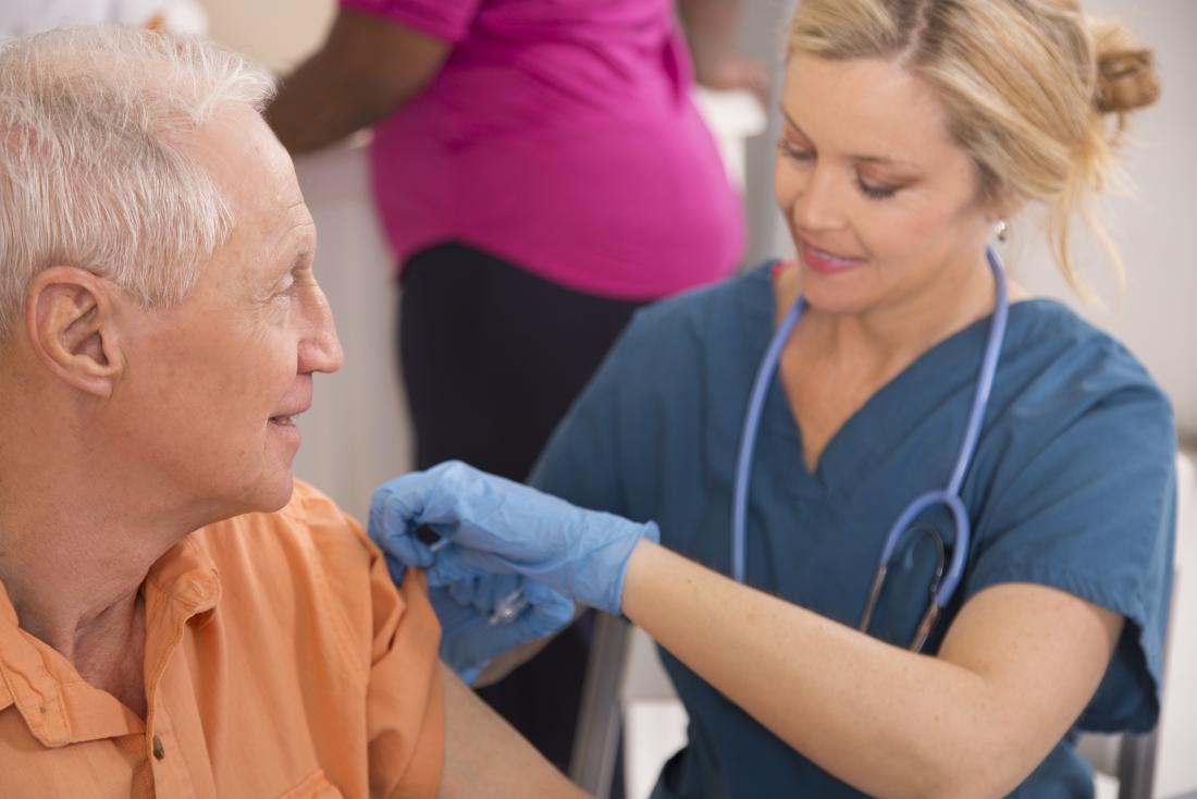 nurse giving a hepatitis b vaccine