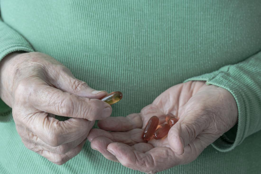 a woman taking fish oil tablets that might also get side effects. 