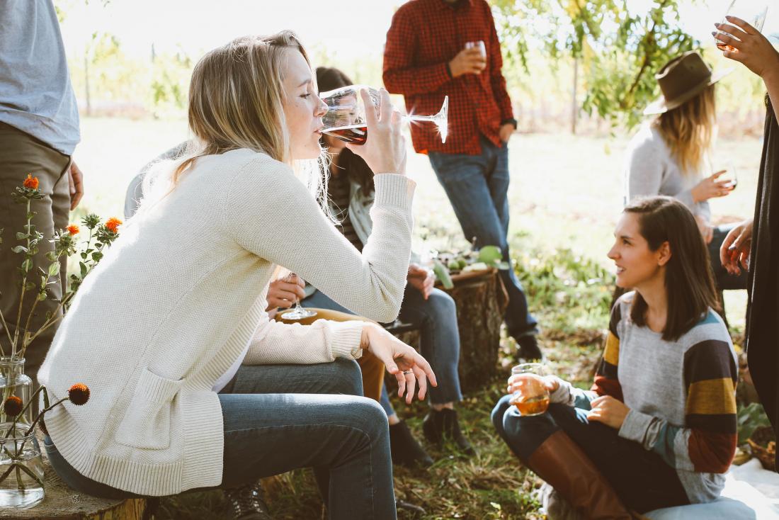 person drinking at a social gathering