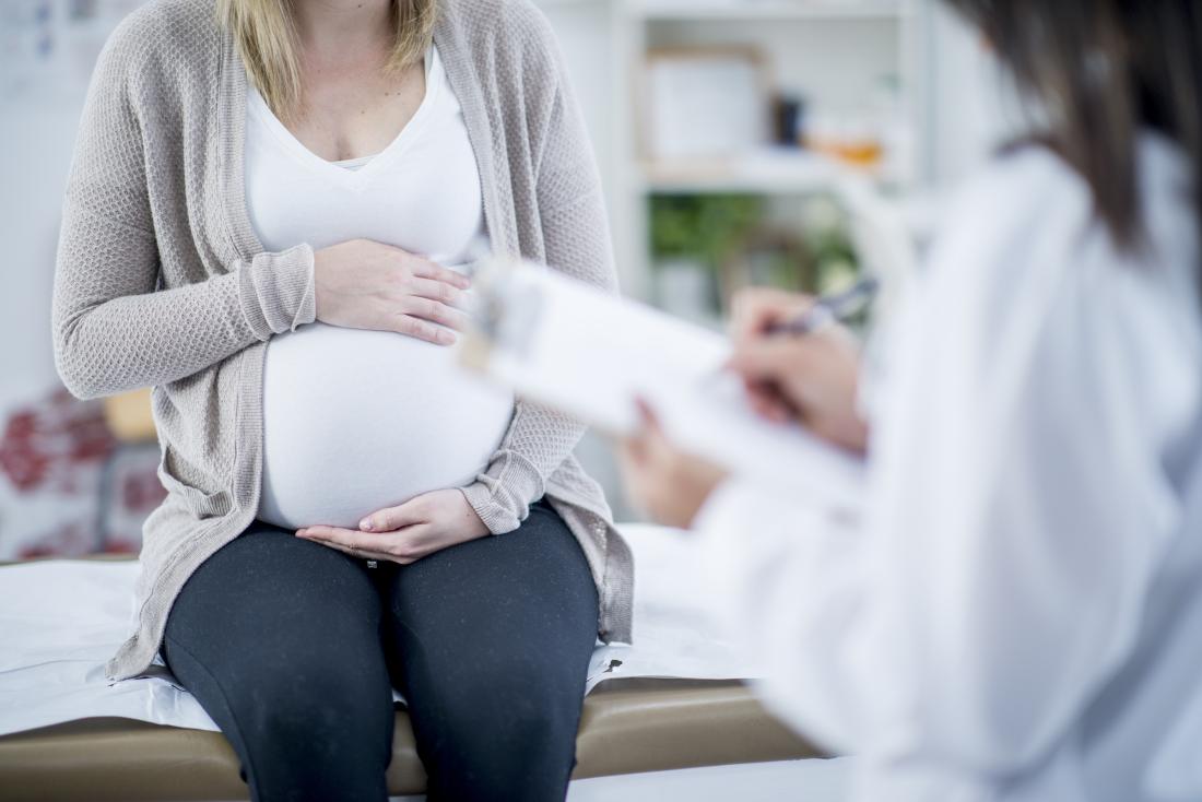 a woman getting a Pregnancy Checkup with a doctor. 