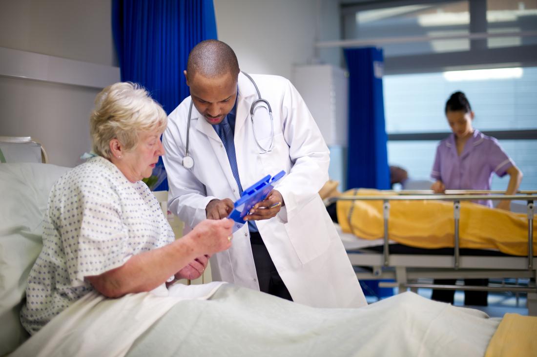 doctor advising patient in hospital
