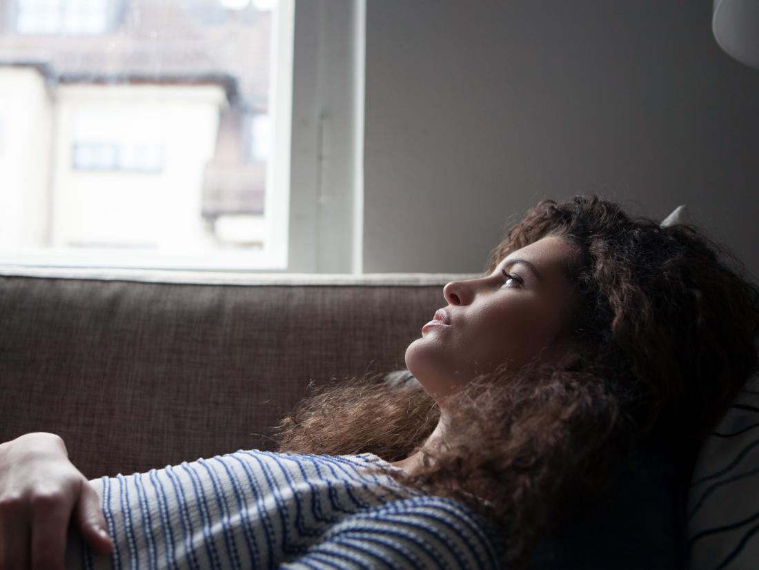 a woman lying down experiencing the Effects of hepatitis C