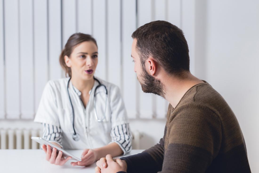a patient with hyperkalemia speaking to doctor in office