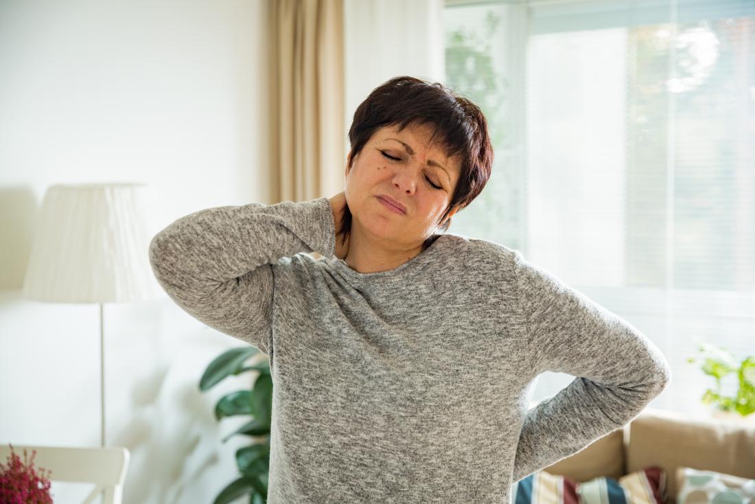 a woman suffering from Muscle fatigue