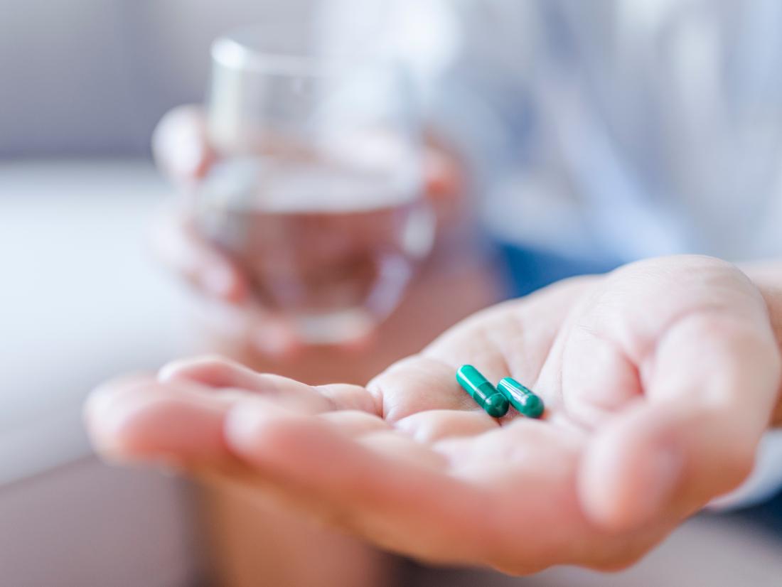a person taking antibiotics