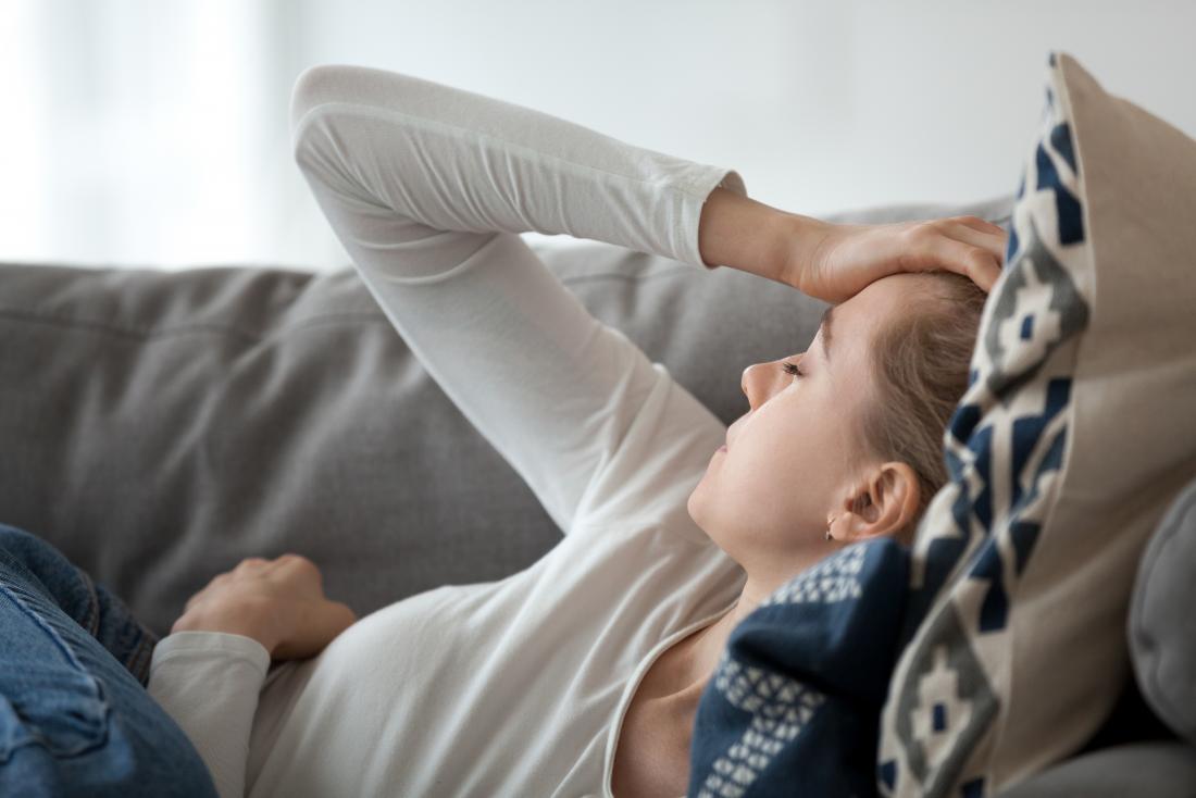 a woman experiencing fatigue from hyperinsulinemia