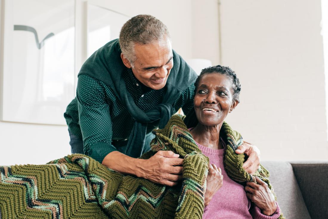 a son with his mother showing how to care for someone with alzheimers