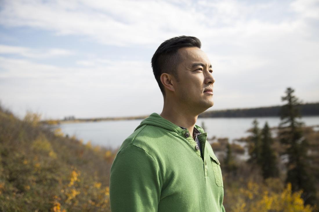 a man outside in nature experiencing generalized anxiety disorder