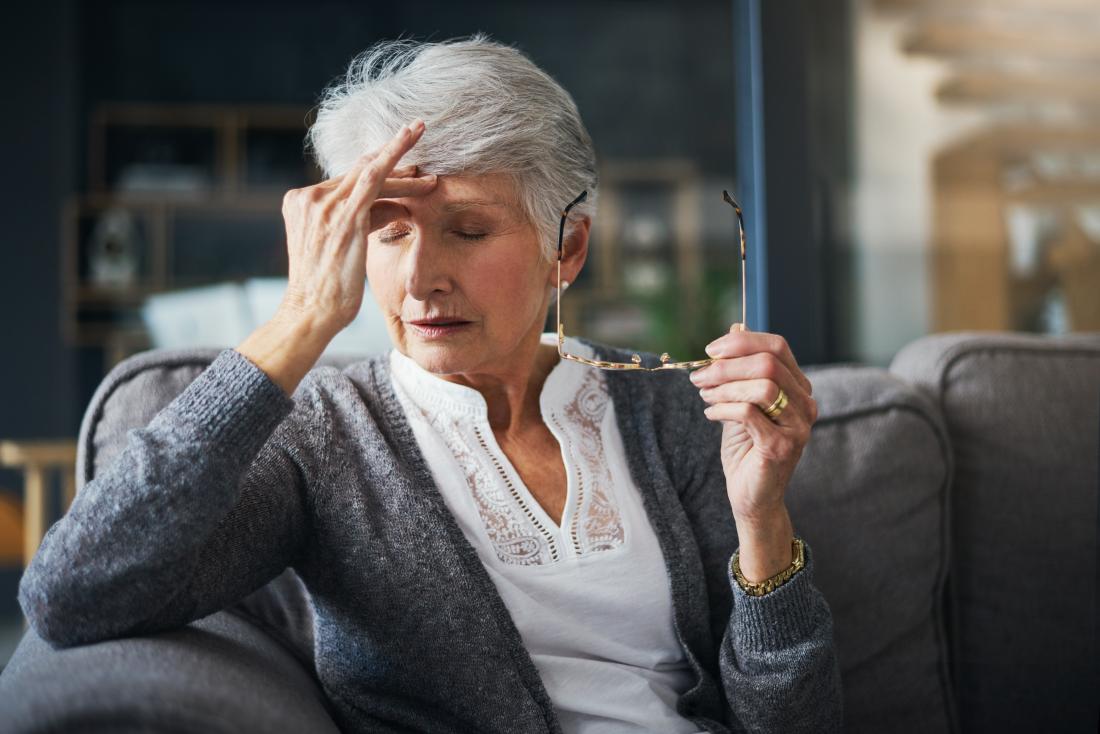 a woman with a headache because of unexplained weight loss