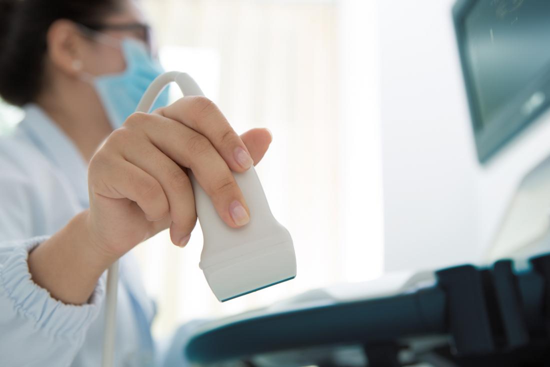 a doctor using an ultrasound