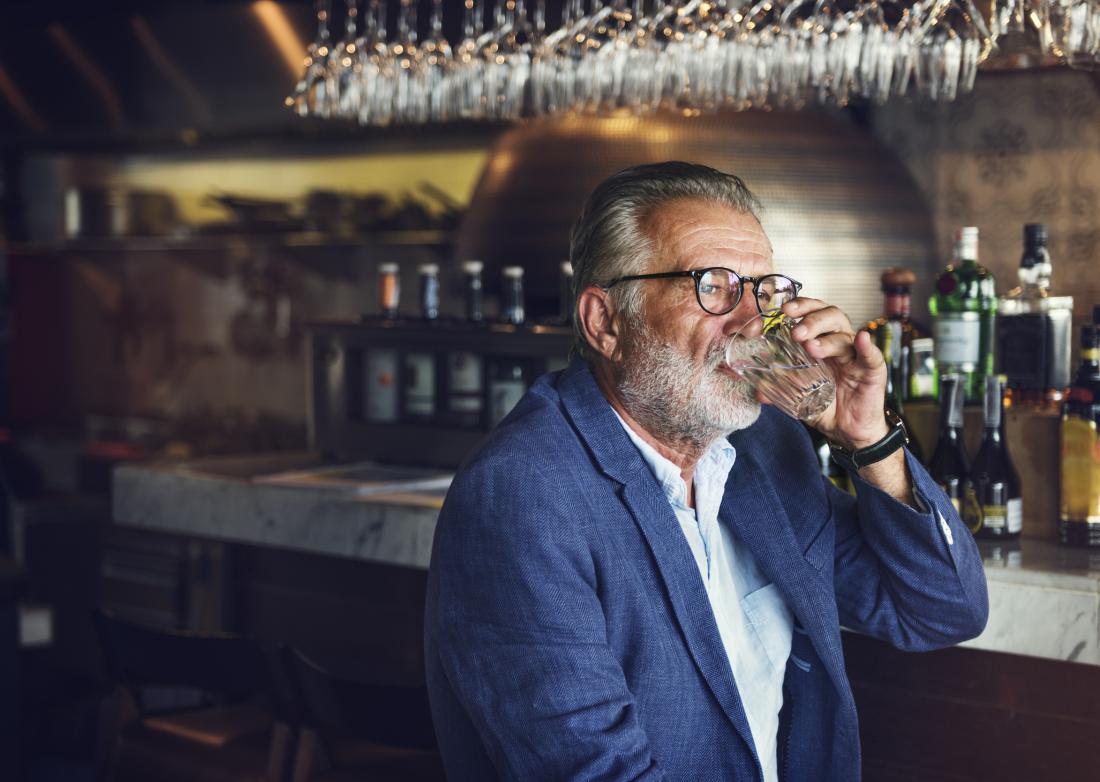 Older adult drinking in bar