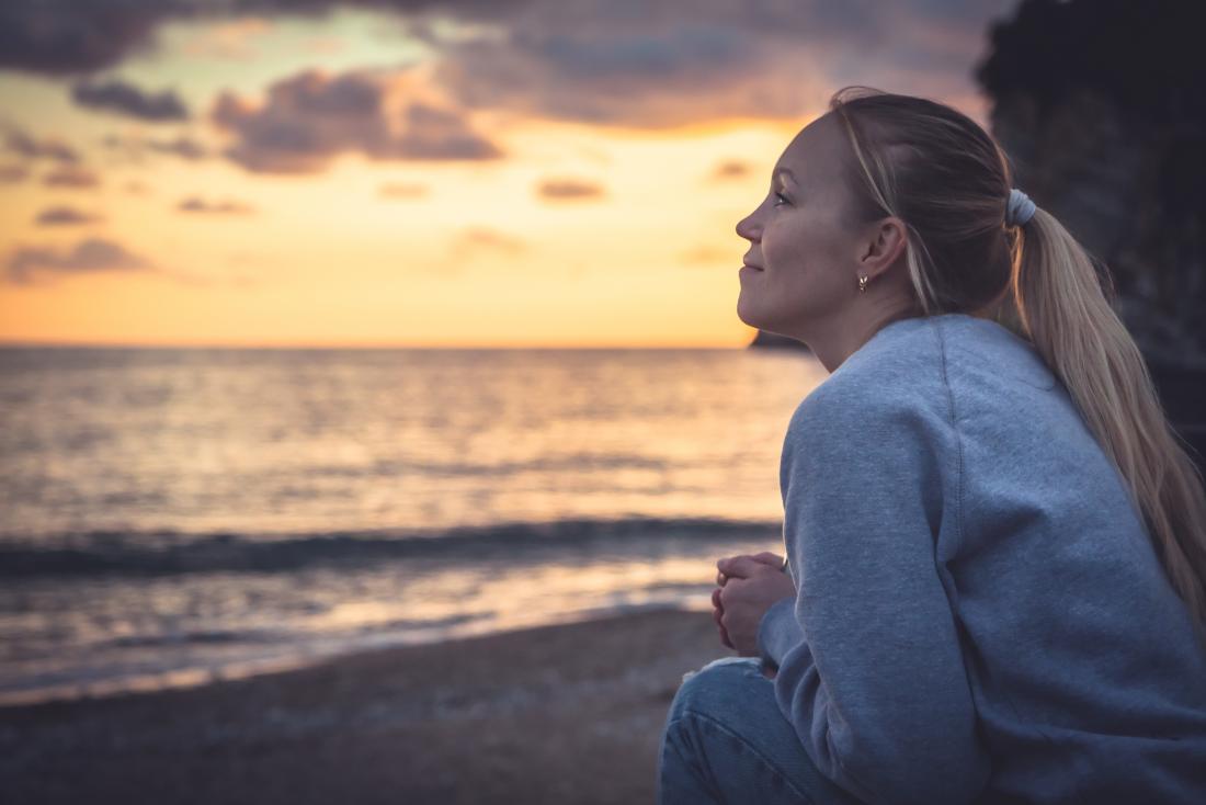 a teenage girl with cystic fibrosis looking out to sea and wondering what her life expectancy is