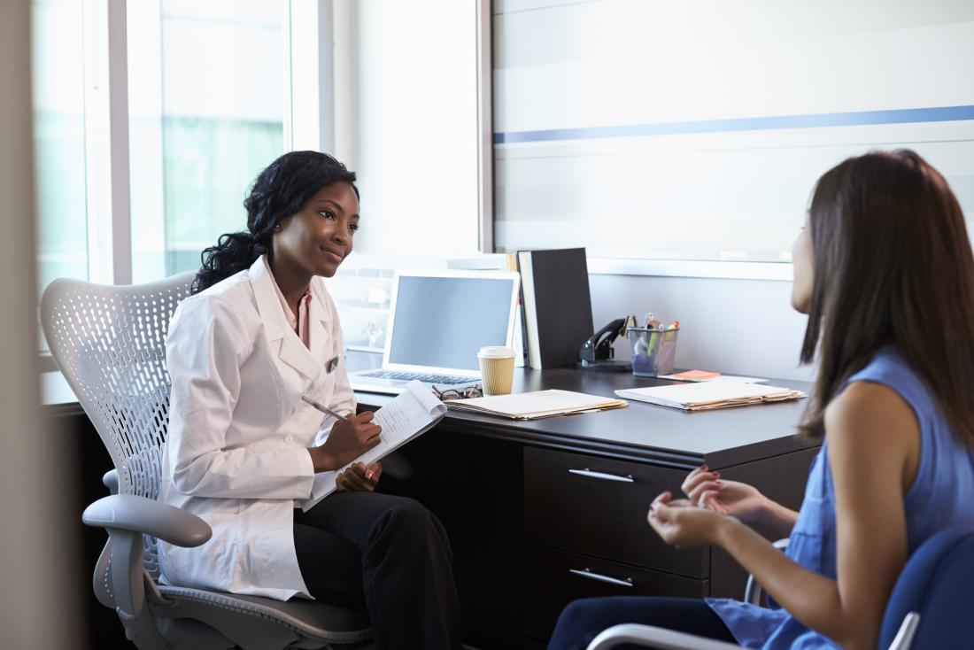 woman speaking with her doctor