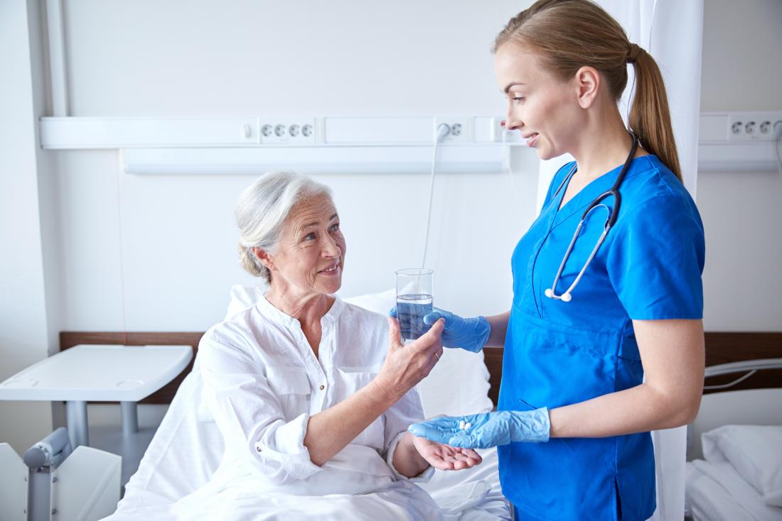 Doctor and patient with pills