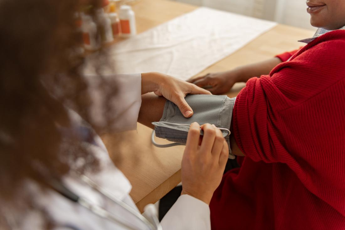 blood pressure monitor being applied to arm of person with potassium deficiency or hypokalemia