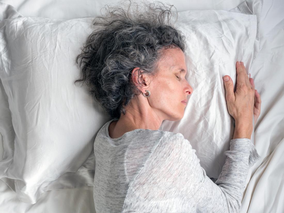 mature woman asleep in bed