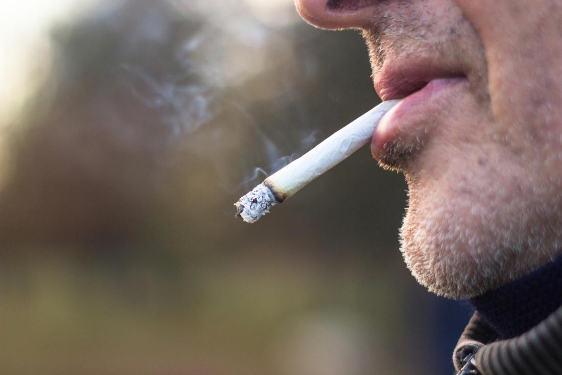 Man smoking close up