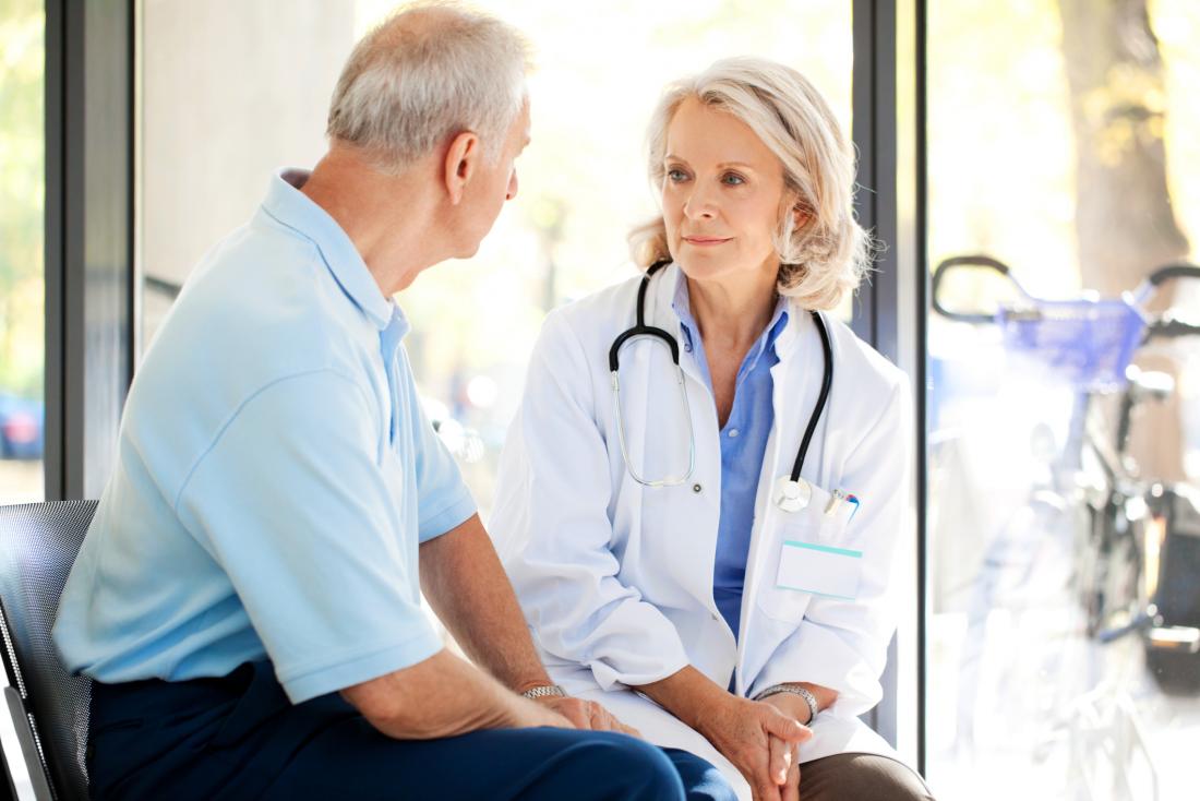 Man talking to doctor