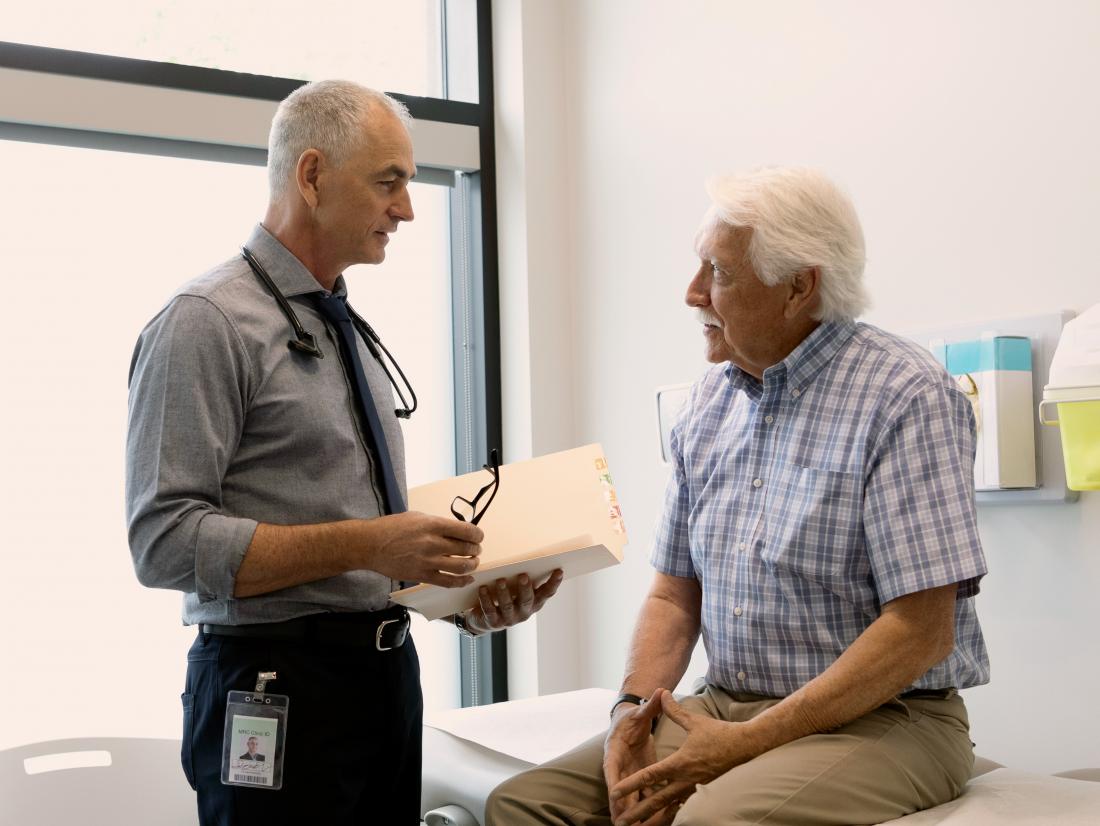 a doctor discussing the possibility of a prostate nodules with a male patient