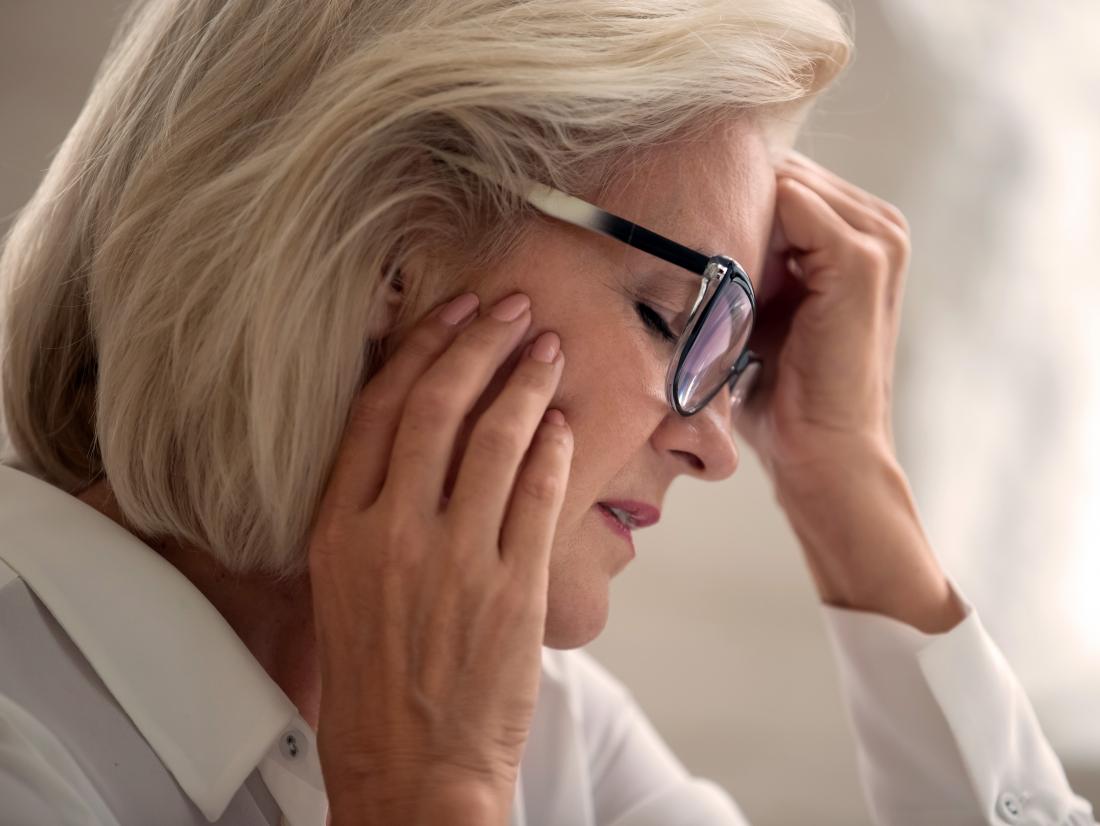a woman experiencing left sided facial numbness and a headache