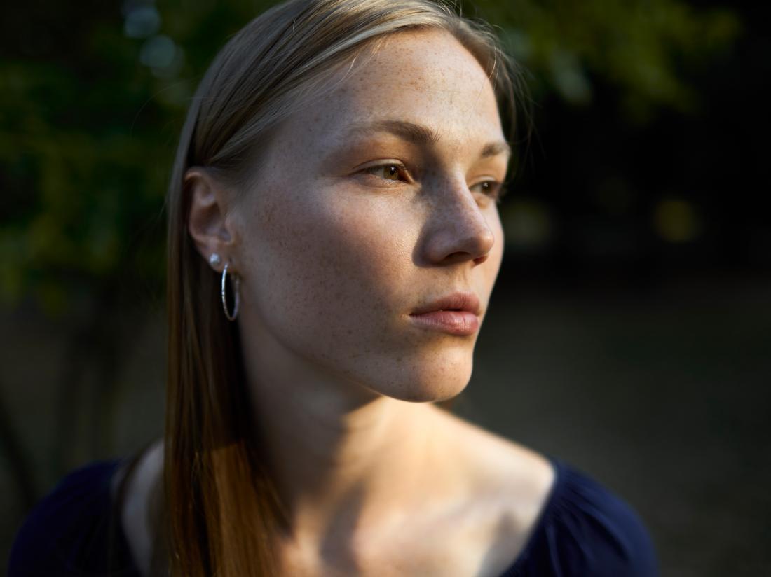 a woman looking pensive because of Cognitive dissonance