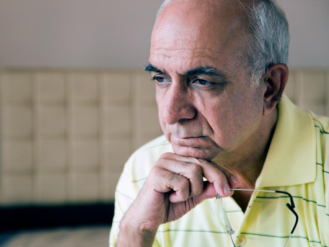a senior man looking pensive because he has apraxia
