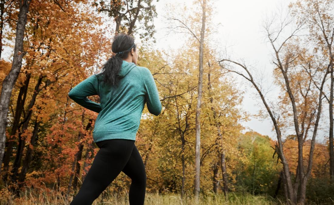 a woman jogging as that is how to lose face fat