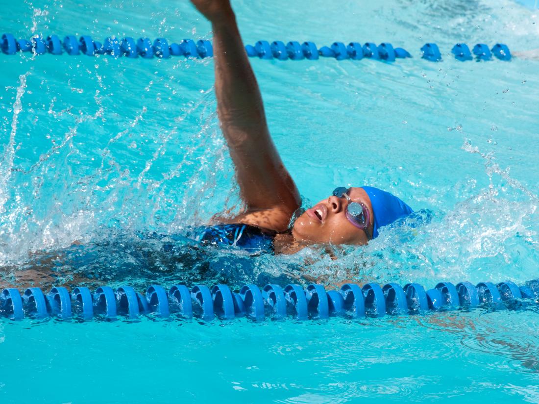 a woman swimming backstroke
