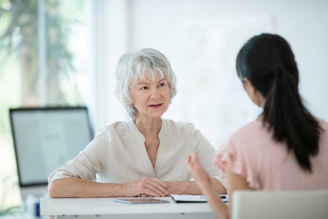 an older lady speaking to a female doctor