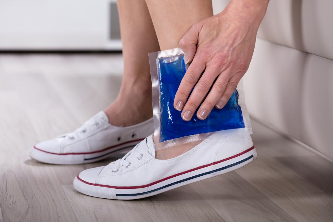 a woman using a cool compress on her leg