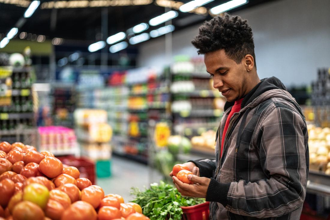 young man grocery shopping<!--mce:protected %0A-->