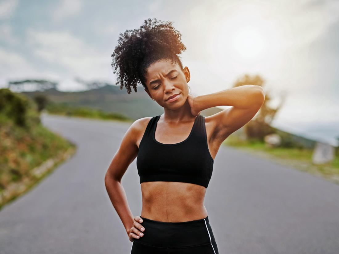 a female runner who is Working out when sore
