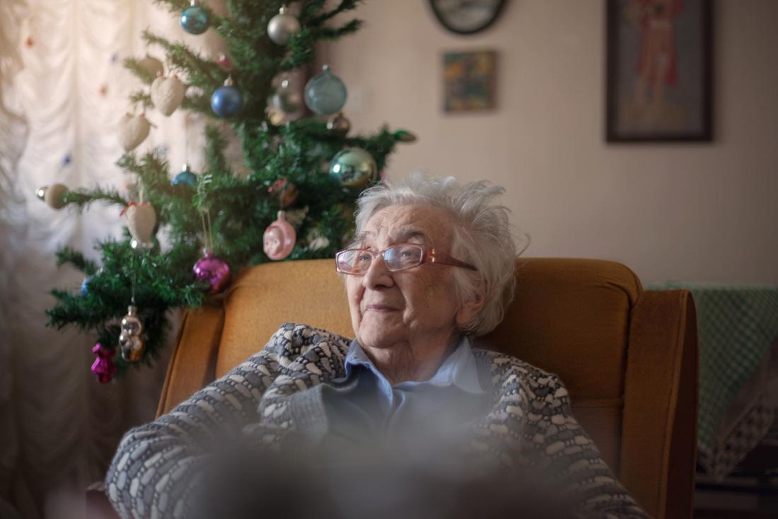 older woman sitting in an armchair