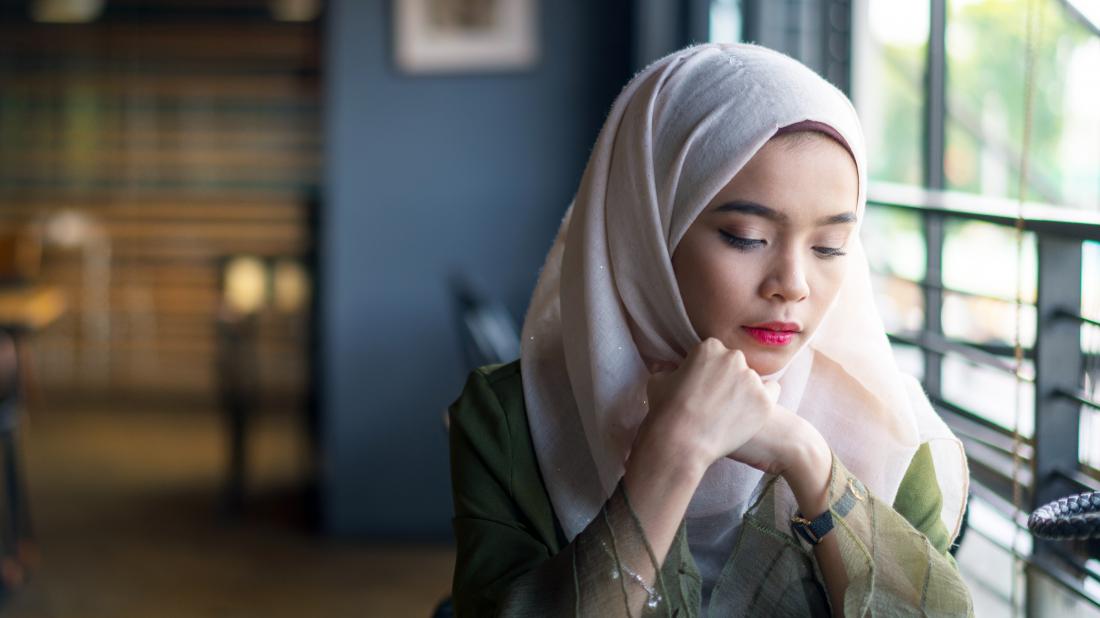 a woman looking sad because she is experiencing one of the Types of depression