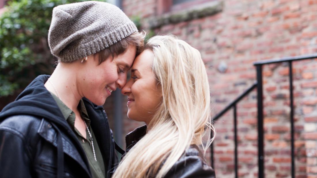 a demisexual couple look into each others eyes
